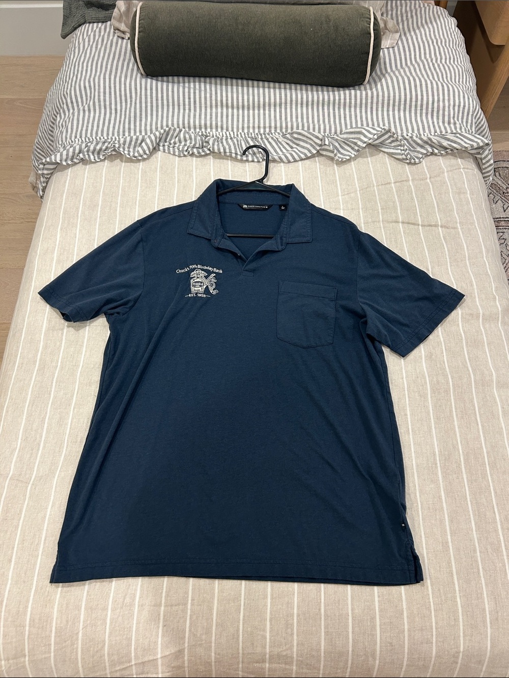 Travis Mathew Navy Short-Sleeve Polo with Chest Pocket and Chuck’s 70th